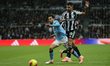 Bernardo Silva of Manchester City breaks away from Bruno Guimaraes of Newcastle United dur...