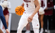 Zion Cruz possesses the ball for the Rider Broncs during an NCAA men's basketball game at...