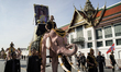 Elephants and mahouts participate in a parade to honor the late Queen Mother Sirikit in fr...