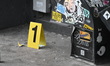 Members of the NYPD Crime Scene Unit investigate the scene where merchandise valued at ove...