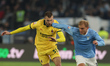 Gustav Isaksen of Lazio and Strahinja Pavlovic of Milan play during the Coppa Italia socce...