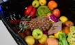 Food products and fruit are displayed at the Restos du Coeur premises during the visit of...