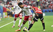 Caio of the United Arab Emirates and Eslam Eissa of Egypt are in action during the Group C...