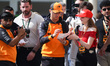 Lando Norris of McLaren signs autographs ahead Formula 1 Abu Dhabi Grand Prix at Yas Marin...