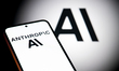The Anthropic AI logo is displayed on a mobile phone with the company AI branding visible...