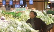 A customer shops for vegetables at a supermarket in Hangzhou, Zhejiang Province, China, on...