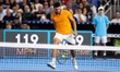 Carlos Alcaraz of Spain returns a shot through his legs during his singles match at the Mi...