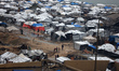 Tents serve as temporary shelters for displaced Palestinians along the coastline of Gaza C...