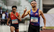 Joshua Robert Atkinson of Thailand crosses the finish line to win the men's 400m finals at...
