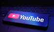 The YouTube logo appears on a smartphone screen in this illustration photo in Reno, United...