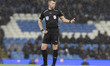 Referee Sam Barrott officiates during the Carabao Cup Quarter Final match between Manchest...
