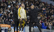 Manchester City F.C. manager Pep Guardiola discusses with the fourth official during the C...