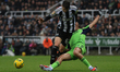 Raul Jimenez of Fulham challenges Lewis Miley of Newcastle United during the Carabao Cup Q...