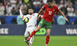 Amin Zahzouk of Morocco and Issam Smeeri of Jordan are in action during the FIFA Arab Cup...
