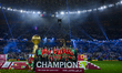 Morocco players celebrate on the podium after winning the FIFA Arab Cup 2025 final match b...
