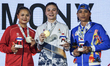 Baison Manikon of Thailand, the gold medalist, celebrates on the podium with Hoang Ngoc Ma...