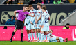 Referee Matthew Donohue moves the Brentford FC defensive wall back during the Premier Leag...