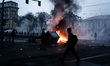 Supporters of the Askatasuna social center clash with riot police in Turin, Italy, on Dece...