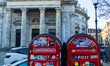 Two Danish red letterboxes stand in front of The Marble Church in Copenhagen, Denmark, on...