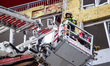 Rescuers from Ukraine's State Emergency Service use an aerial work platform to deal with t...