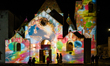 The Church of St. Anthony is illuminated near the trulli of Alberobello during the Christm...