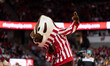 Bucky Badger entertains the crowd during the college basketball game between the Wisconsin...
