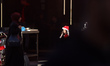 Palestinian children wear Santa Claus costumes and walk past a shop displaying New Year de...
