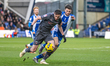 Liam Mandeville of Chesterfield and Jamie Robson of Oldham Athletic battle for possession...