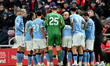 Manchester City manager Pep Guardiola gives instructions to his players during the Premier...