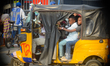Children arrive at the National Museum at Onikan in a tricycle on Thursday, as mixed busin...