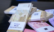 Syrian exchange offices replace old Syrian banknotes with newly issued ones in Syria on Ja...
