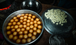 Rasgullas, traditional cottage cheese dumplings cooked in sugar syrup, are prepared by swe...