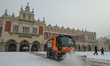 KRAKOW, POLAND – JANUARY 8:A small truck equipped with a snow plow is seen amid snowfall...