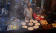 An indian cook of a local street food shop, prepares food ,  , on the eve of Muslim's holy...