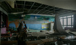 A journalist documents a collapsed school ceiling in Jakarta, Indonesia, on January 12, 20...