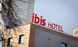 The ibis Gdansk Stare Miasto hotel logo appears on the exterior of the hotel building duri...