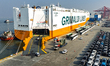 A roll-on/roll-off ship loads new energy vehicles at the Taicang Port of Suzhou Port in Su...