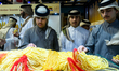 Visitors look at items displayed during the Katara International Exhibition for Kahraman,...