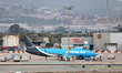 An Amazon Air Boeing 737-84P(SF) parks next to an American Airlines aircraft in the cargo...