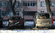 Damaged cars are seen outside a primary school building damaged by falling debris from a R...