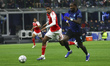 Cristian Mosqueira and Marcus Thuram play during the UEFA Champions League 2025/26 match b...