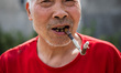 A portrait of a farmer is taken in Shifuo, Sichuan Province, China, on April 16, 2025. 