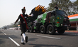 Soldiers stand on a launcher vehicle with missiles ahead of the final dress rehearsal for...