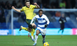 George Thomason of Wrexham chases Kader Dembele of Queens Park Rangers during the Sky Bet...