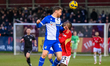 Tom Lockyer of Bristol Rovers beats Daniel Udoh of Salford City FC to the head shot during...
