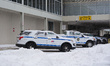 Service vehicles park amid plowed snow at Tulsa International Airport in Tulsa, Oklahoma,...
