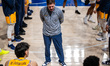 Zach Spiker, the head coach of the Drexel Dragons, addresses the team before an NCAA men's...