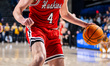 MIKE LOUGHNANE (4) of the Northeastern Huskies possesses the ball during an NCAA men's bas...