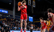 Xavier Abreu of the Northeastern Huskies gets a rebound during an NCAA men's basketball ga...