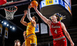 KEVON VANDERHORST (3) of the Drexel Dragons is blocked by MIKE LOUGHNANE (4) of the Northe...